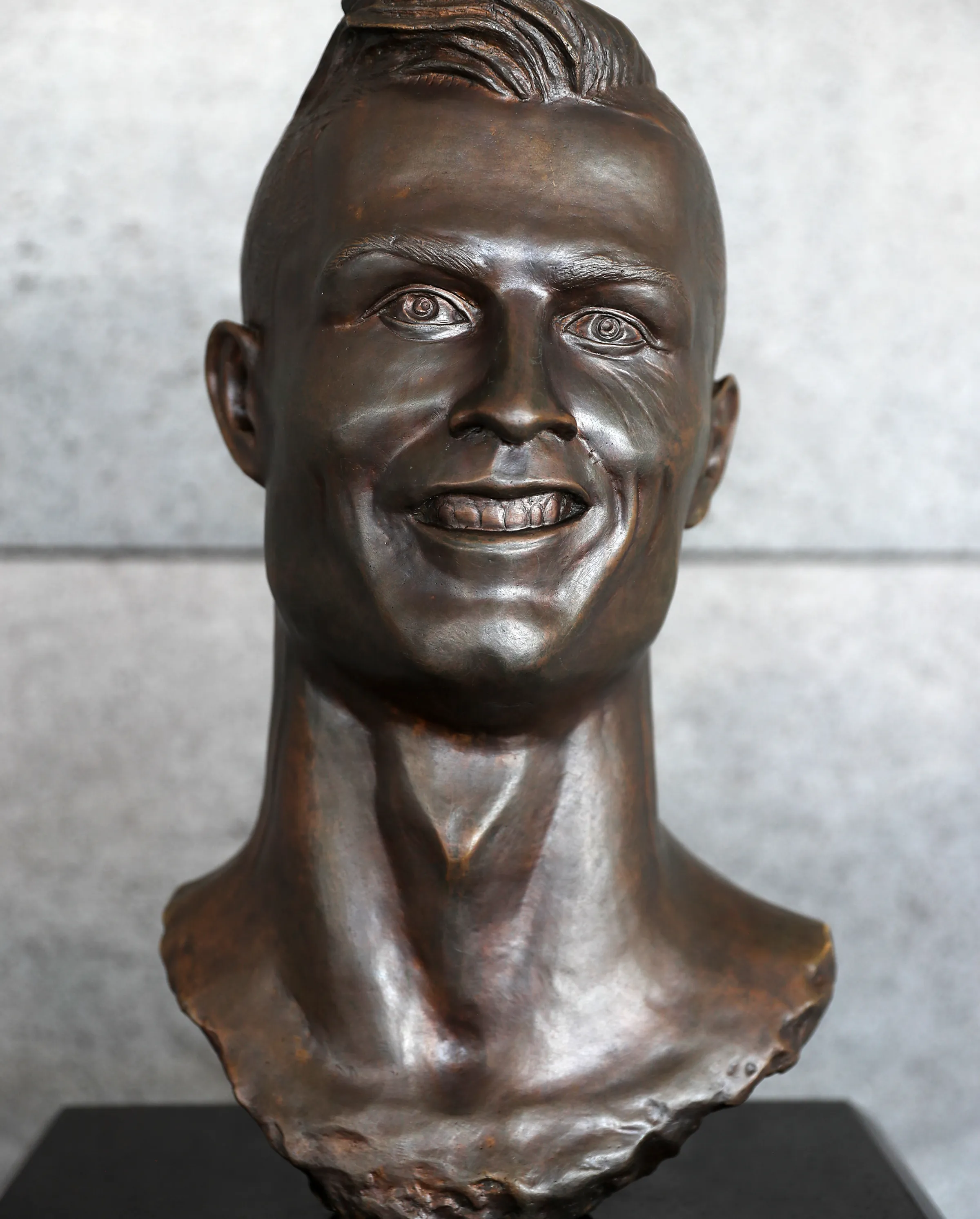 A bronze bust of Cristiano Ronaldo.
