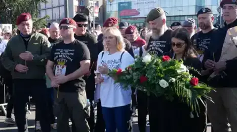 Families of those who died at Novi Sad laid flowers at the train station 