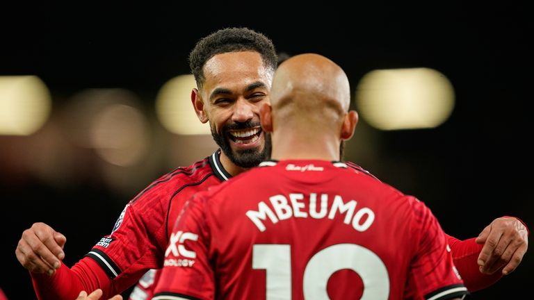 Manchester United's Bryan Mbeumo, front, celebrates with Matheus Cunha