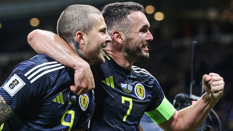 Lyndon Dykes (L) scored his 10th Scotland goal while  John McGinn won his 80th international cap vs Greece