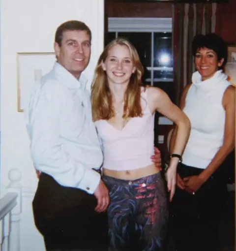PA Media Andrew is seen with his arm around Virginia Giuffre, with Ghislaine Maxwell in the background.