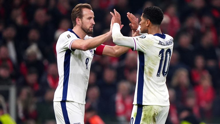 Harry Kane celebrates scoring England's second goal against Albania with team-mate Jude Bellingham