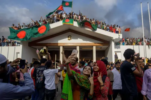 Lightrocket/Getty Images Anti-government protesters storm Hasina's palace in Dhaka