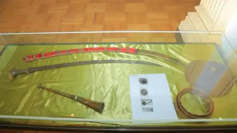 Ethiopia's Tourism Ministry A display of historical shields and a paper with their prints 