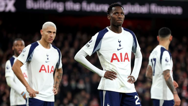 Spurs players look dejected in their 4-1 loss at Arsenal