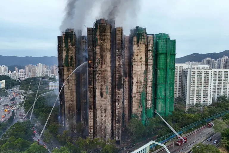 A drone view shows flames and thick smoke rising from the Wang Fuk Court housing 