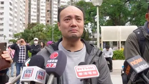 BBC News Chinese Mr Chung, in a grey windbreaker, was devastated when interviewed by media
