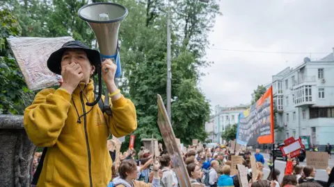 Getty Images KYIV, UKRAINE - JULY 31: Activists with banners rally near the Verkhovna Rada to protest a law that restricts the independence of anti-corruption institutions on July 31, 2025 in Kyiv, Ukraine. On July 22, the Verkhovna Rada of Ukraine passed draft law No. 12414, which limits the activities of the National Anti-Corruption Bureau and the Specialized Anti-Corruption Prosecutor's Office, previously independent bodies. These institutions, originally established to combat high-level corruption, are now subordinate to the Prosecutor General, who is appointed by the President. Amid the protests, in his address on July 23, President Volodymyr Zelenskyi announced that a bill is being prepared to repeal the restrictions imposed on NABU and SAPO by the earlier law No. 12414. On July 31, the Verkhovna Rada passed a bill restoring the independence of NABU and SAPO. 