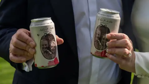 Reuters A close-up image of two custom made beer cans featuring images of Albanese and Jodie Haydon