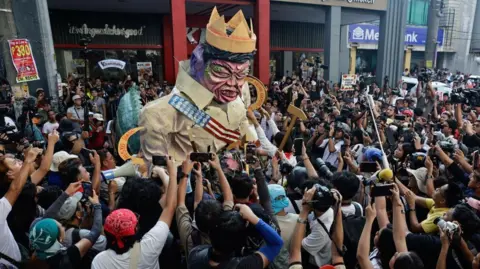 EPA People take pictures of an effigy of President Ferdinand "Bongbong" Marcos Jr