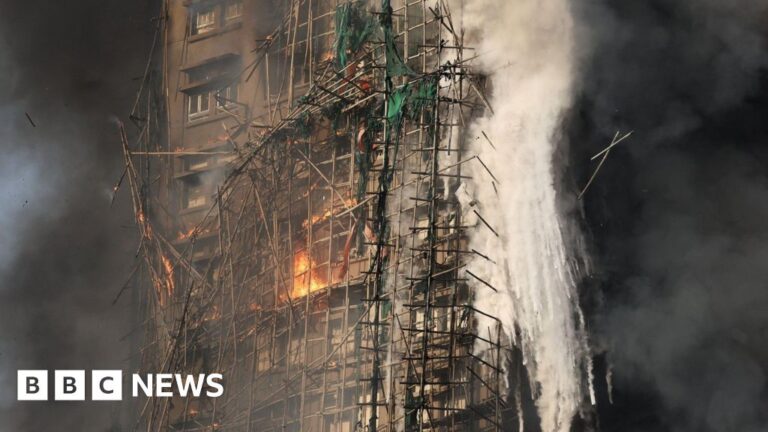 Firefighters search for missing in tower blocks fire