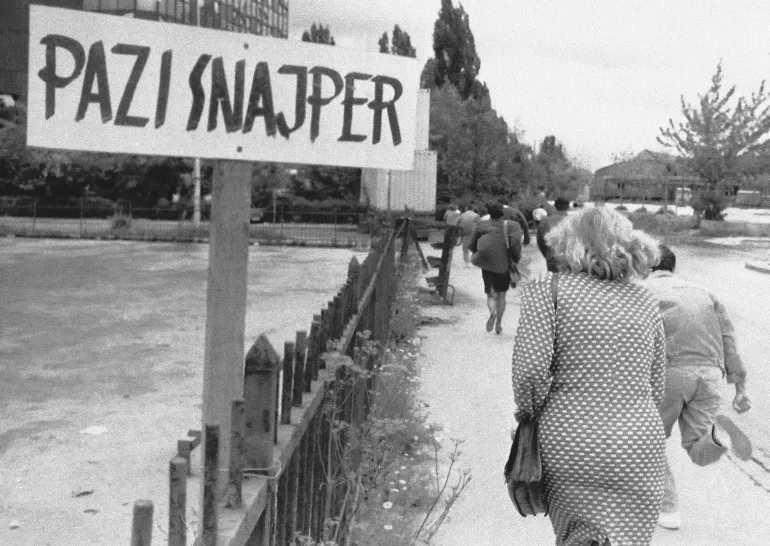New signs are appearing over the besieged city of Sarajevo to alert the people of the whereabouts of sniper fire in Sarajevo,