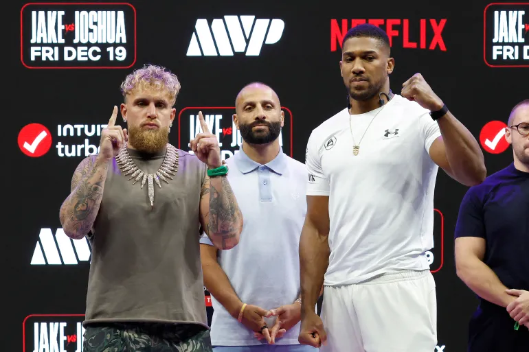Jake Paul and Anthony Joshua react.