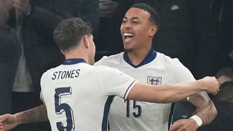 England's Morgan Rogers, right, celebrates after scoring his side's opening goal during an international friendly against Wales
