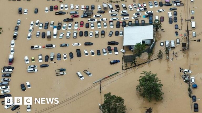Scores killed and thousands evacuated from record rainfall