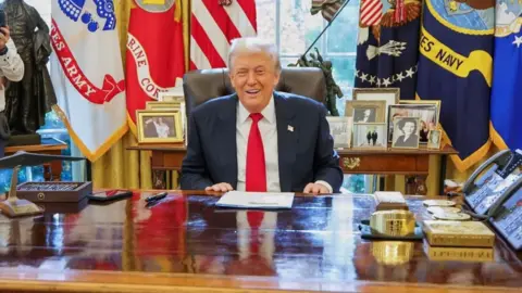 AP President Donald Trump, smiles during his meeting with Syria's President Ahmad al-Sharaa, at the White House in Washington, Monday, Nov. 10, 2025