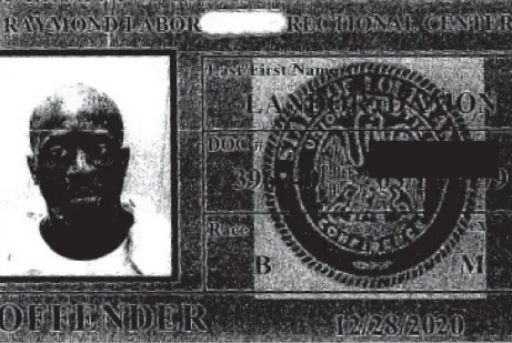 A prison ID showing Landor after his head was shaved.