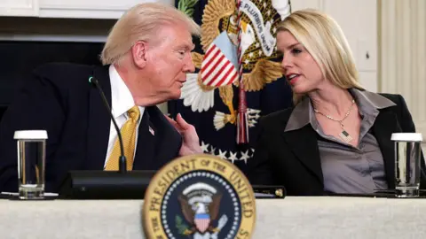 Getty Images File photo of Trump speaking with Pam Bondi