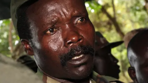 AFP via Getty Images Joseph Kony is seen in a camouflage uniform, and is wearing a cap in this archive photo