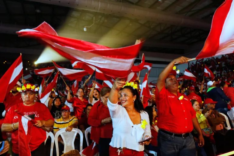 Supporters of Honduran candidate Salvador Nasralla cheer at a political event