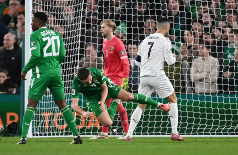 DUBLIN, IRELAND - NOVEMBER 13: Dara O'Shea of Republic of Ireland reacts after being fouled by Cristiano Ronaldo of Portugal during the FIFA World Cup 2026 qualifier match between Republic of Ireland and Portugal at Aviva Stadium on November 13, 2025 in Dublin, Ireland. (Photo by Charles McQuillan/Getty Images)