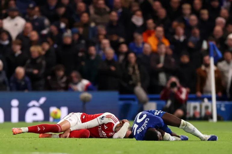 LONDON, ENGLAND - NOVEMBER 30: Moises Caicedo of Chelsea reacts after fouling Mikel Merino of Arsenal for which he subsequently received a red card after a VAR review during the Premier League match between Chelsea and Arsenal at Stamford Bridge on November 30, 2025 in London, England. (Photo by Ryan Pierse/Getty Images)