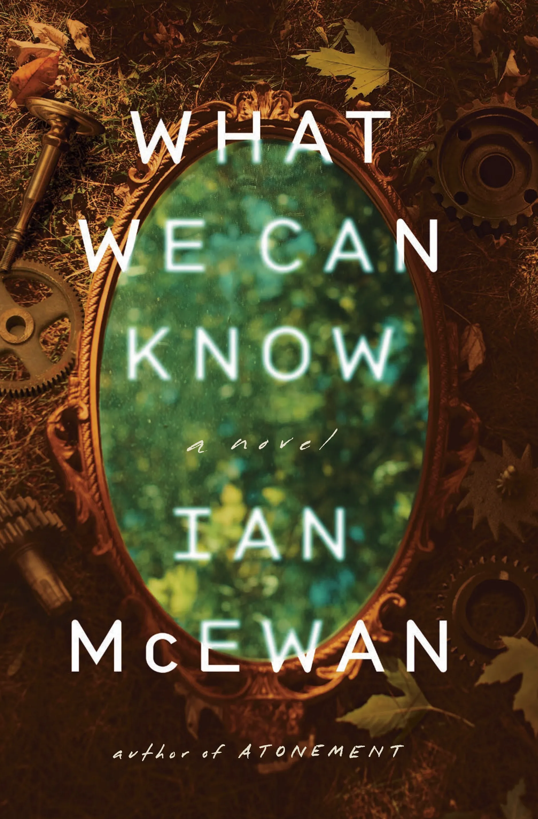 A vintage gold mirror with a green glass