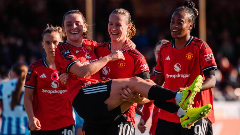 Elisabeth Terland celebrates with Ella Toone after opening the scoring for Manchester United at Brighton