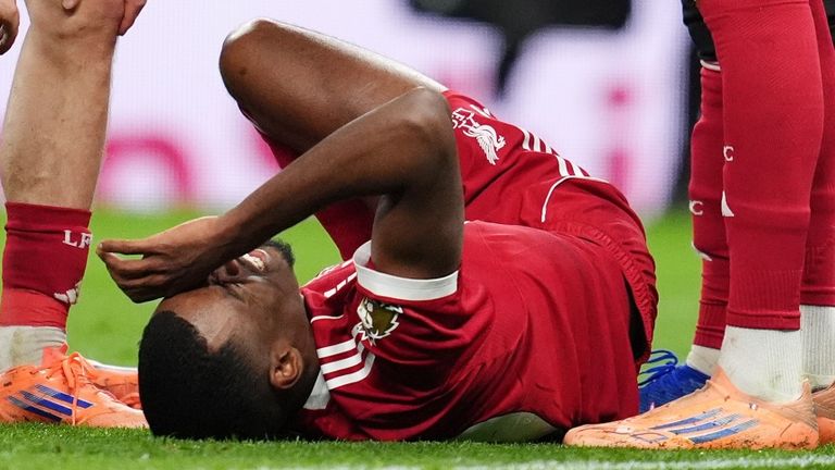 Liverpool's Alexander Isak goes down injured against Spurs