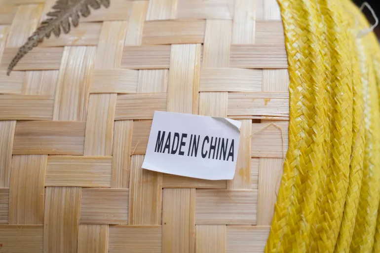A made in China sticker is displayed on a hat at a store in Chinatown in San Francisco, USA