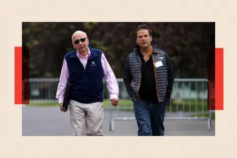 Reuters Rupert Murdoch (L) and his son Lachlan walk together