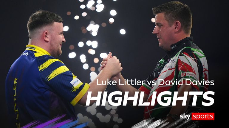 England's Luke Littler (left) shake hands with Wales' David Davies following victory in the Round 2 match on day eleven of the Paddy Power World Darts Championship at the Alexandra Palace, London.