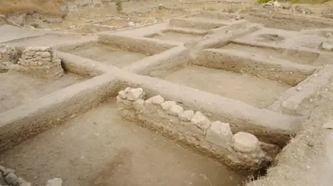 Getty Images Foundations of ancient houses at an archaeological site