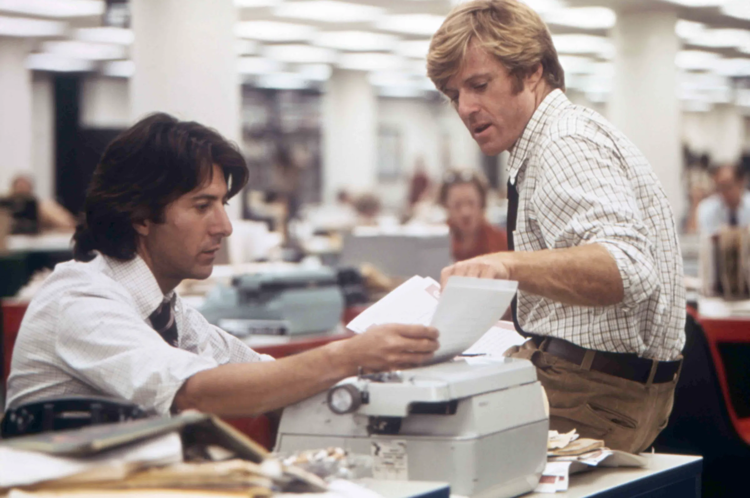 A still from the movie All The President’s Men showing actors Dustin Hoffman and Robert Redford.