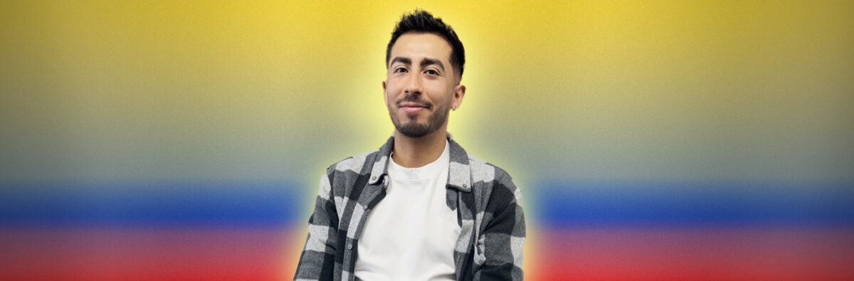 Colombian man smiling on colombian flag background