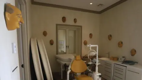 US Congress A room what what looks like a dentist's chair in the middle and masks hanging on the walls