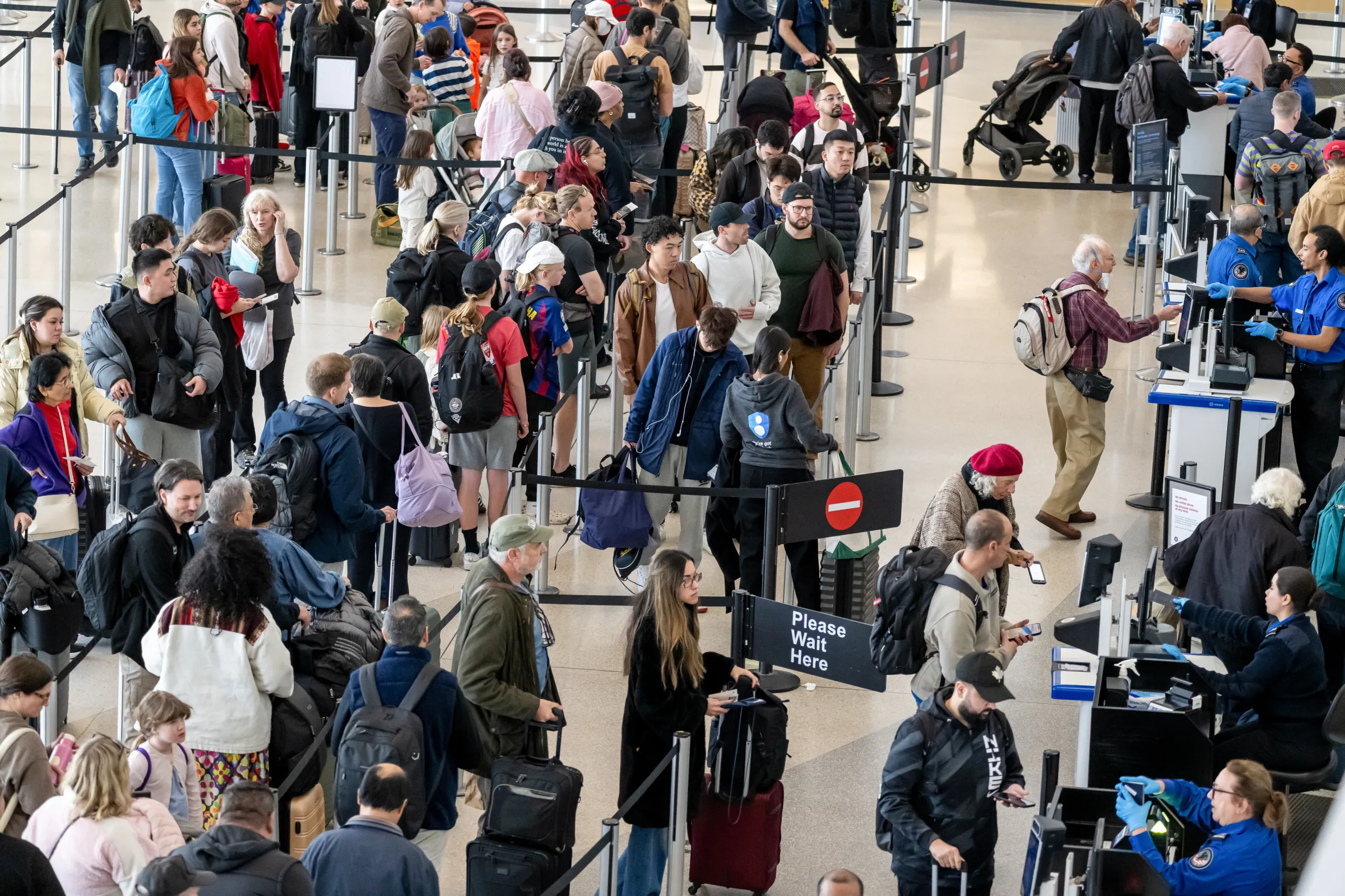 A security line is filled with passengers.