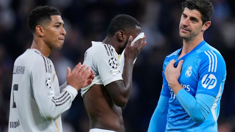 Real Madrid's Jude Bellingham, Antonio Rudiger and goalkeeper Thibaut Courtois, from left, gesture at the end of a Champions League opening phase soccer match between Real Madrid and Manchester City, in Madrid, Spain, Wednesday, Dec. 10, 2025. (AP Photo/Manu Fernandez)