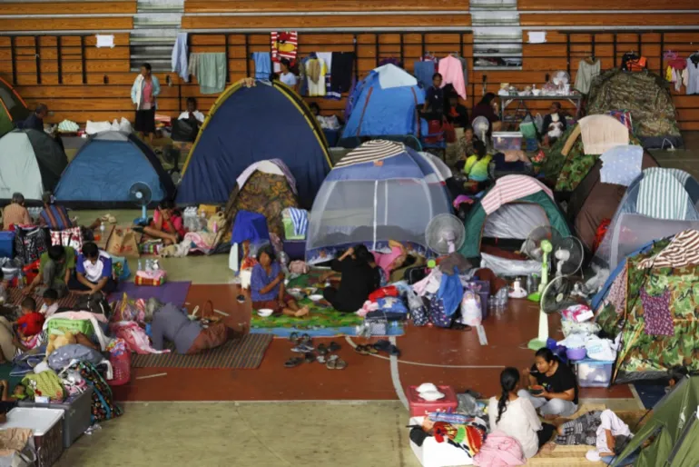 epaselect epa12586883 Displaced Thai villagers who fled their homes following clashes between Thai and Cambodian troops rest at an evacuation center in Si Sa Ket province, Thailand, 12 December 2025. According to Thailand's defense ministry spokesperson Surasant Kongsiri, the military will continue operations against Cambodia until Phnom Penh changes its stance and returns to the genuine path of peace. EPA/RUNGROJ YONGRIT