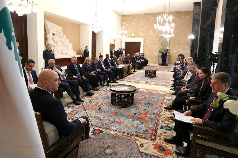 A handout photograph released by the Lebanese presidency's press office shows Lebanese President Joseph Aoun (L) speaking with Slovenia's UN Ambassador Samuel Zbogar (R) during a meeting with a United Nations Security Council delegation at the Presidential Palace of Baabda, east of Beirut, on December 5, 2025. Aoun asked the UN Security Council delegation to pressure Israel to abide by the implementation of the ceasefire, calling for support for the army in order to complete its work in the mission of limiting weapons in the south of the country. (Photo by Handout / Lebanese Presidency / AFP) / RESTRICTED TO EDITORIAL USE - MANDATORY CREDIT "AFP PHOTO / LEBANESE PRESIDENCY" - HANDOUT - NO MARKETING NO ADVERTISING CAMPAIGNS - DISTRIBUTED AS A SERVICE TO CLIENTS