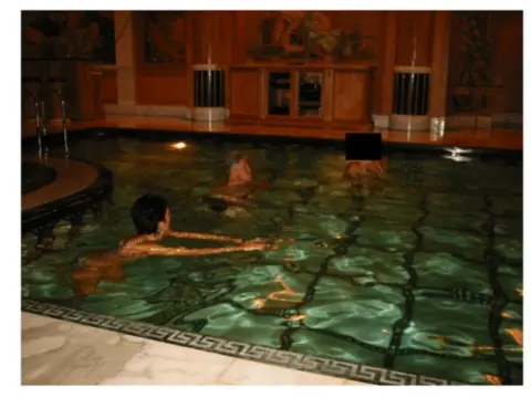 US Department of Justice Clinton is seen swimming in a pool. 