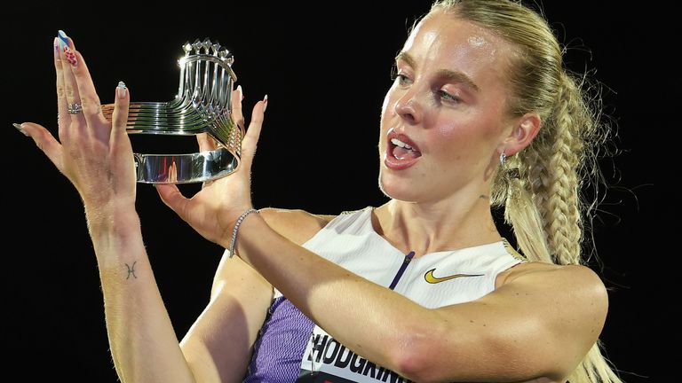 Keely Hodgkinson poses with her Tiffany & Co crown presented to her for winning the 800m at ATHLOS in New York
