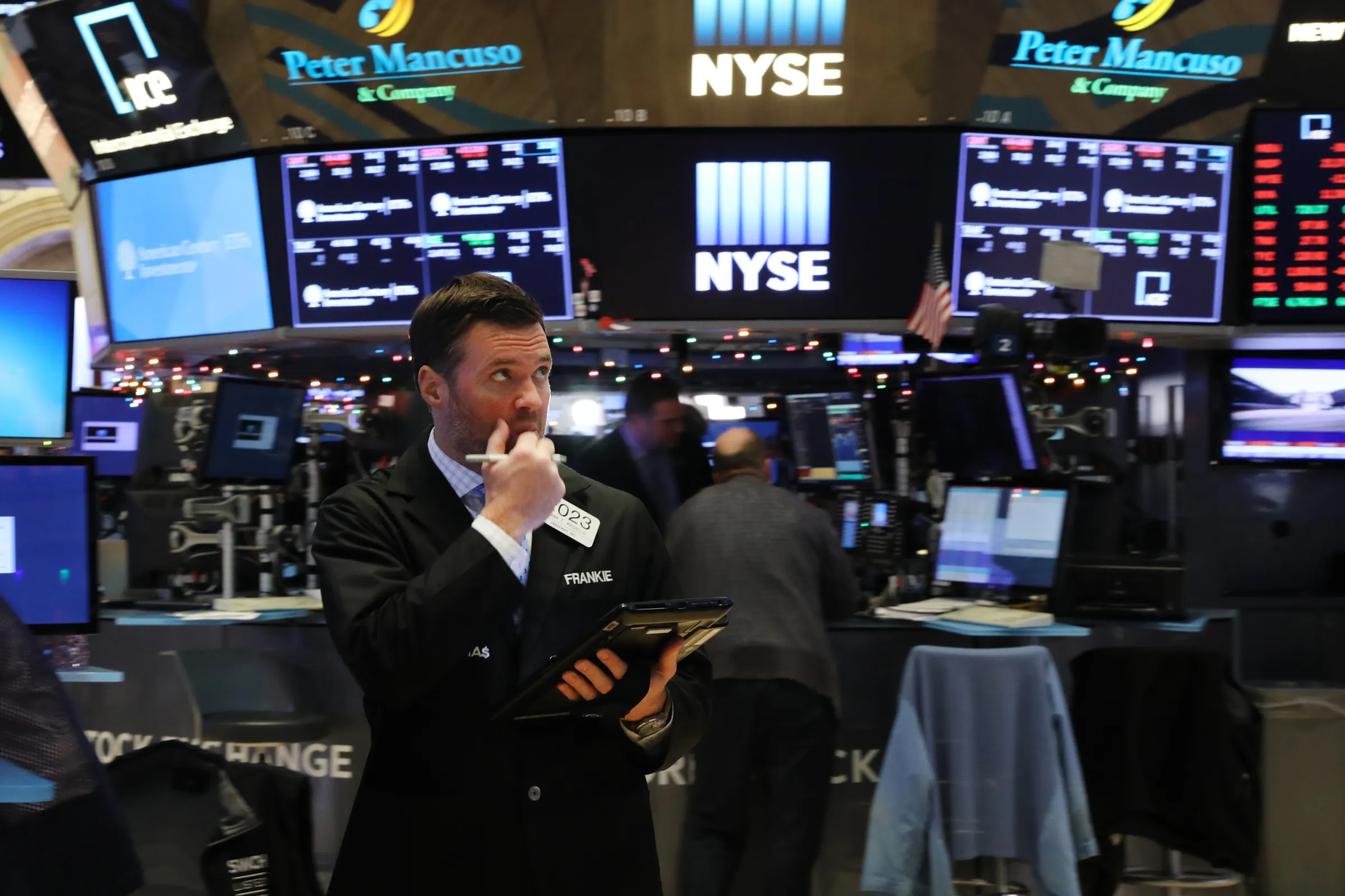 Stock traders look anxious on the floor of the New York Stock Exchange