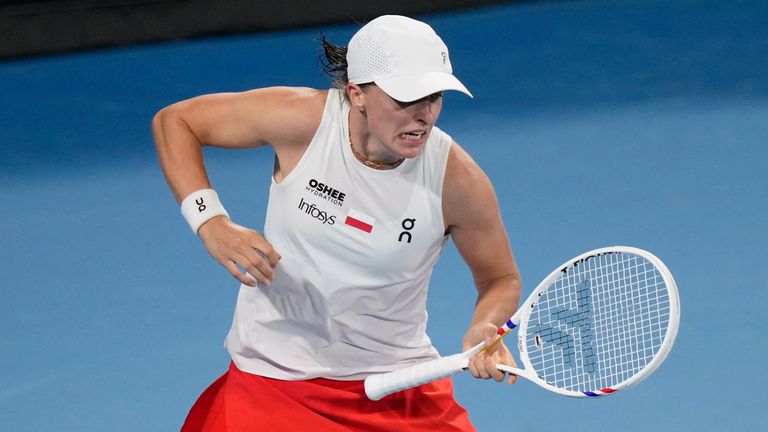 Iga Swiatek of Poland celebrates her win over Eva Lyss of Germany in their women's singles match at the United Cup tennis tournament in Sydney, Monday, Jan. 5, 2026. (AP Photo/Rick Rycroft)