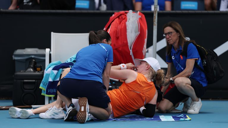 Fran Jones of Great Britain receives medical treatment in the Women's Singles First Round against Linda Klimovicova of Poland during da