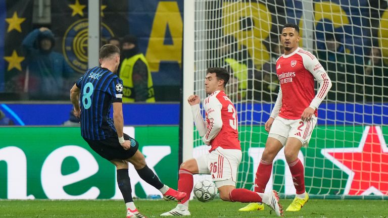 Inter Milan's Petar Sucic, left, scores his side's opening goal during the Champions League opening phase soccer match between Inter Milan and Arsenal in Milan, Italy, Tuesday, Jan. 20, 2026. (AP Photo/Luca Bruno)