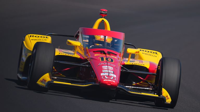 Alex Palou, of Spain, drives through the third turn during qualifications for the Indianapolis 500 auto race at Indianapolis Motor Speedway in Indianapolis, Sunday, May 18, 2025. (AP Photo/Michael Conroy)