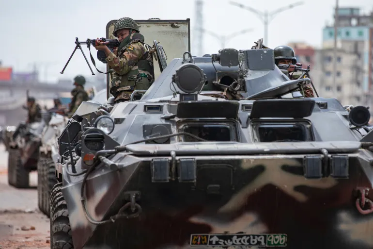 Bangladeshi military force soldiers on armored vehicles patrol the streets of Dhaka, Bangladesh, Saturday, July 20, 2024. (AP Photo/Rajib Dhar)