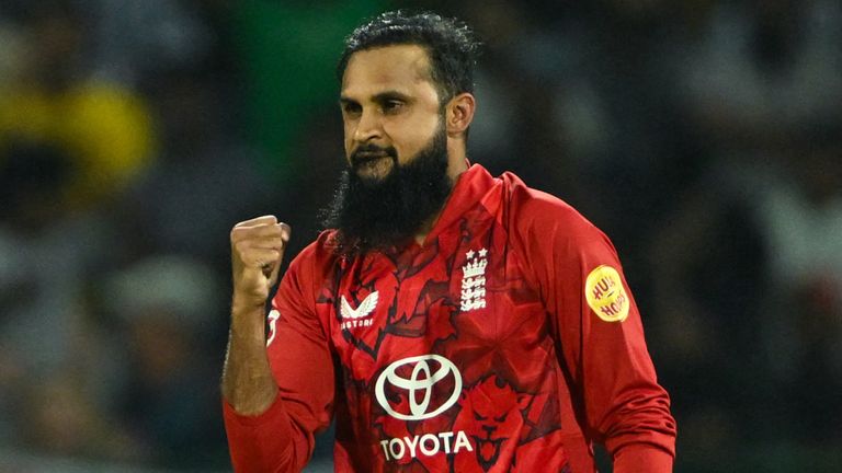 England's Adil Rashid (R) celebrates after taking the wicket of Sri Lanka's Dhananjaya de Silva (L) during the first Twenty20 international cricket match between Sri Lanka and England at the Pallekele International Cricket Stadium in Kandy on January 30, 2026. (Photo by Ishara S. KODIKARA / AFP)
