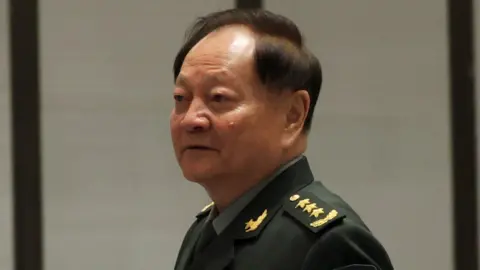 Reuters Zhang Youxia arrives for a group photo session before the opening ceremony of the Western Pacific Naval Symposium in Qingdao, Shandong province